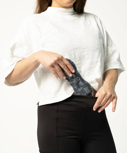 Woman inserting Uterine Ice/Heat Pack into VieWear Leggings